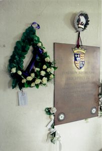 Canadian wreath next to plaque in church