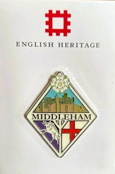 Photograph of a pin. It says Middleham in the middle