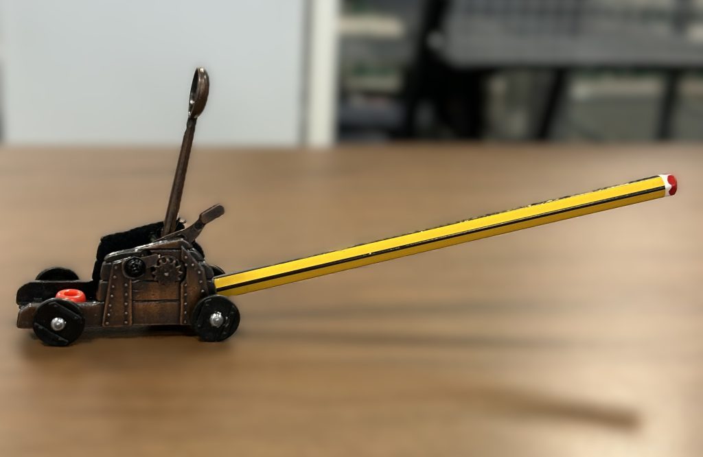catapult with a pencil inserted into the sharpener
